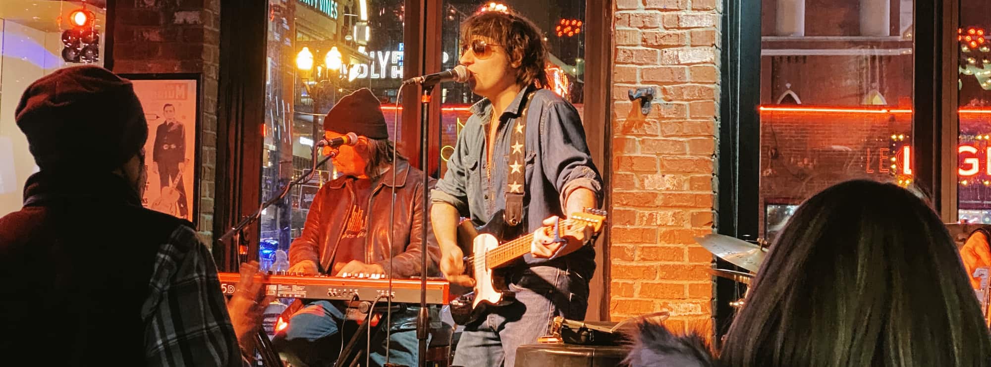 bar singer on guitar in Nashville